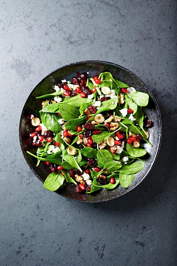 Spinach Salad With Dried Cranberries, Pomegranate Seeds And Toasted