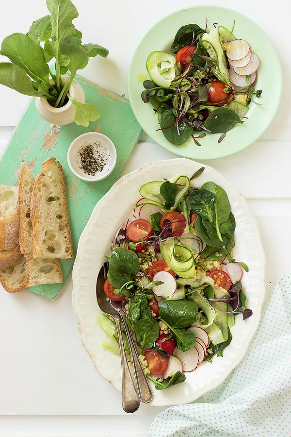 Spinach Salad With Radishes, Cucumber, Beetroot Leaves, Cherry Tomatoes, Quinoa, Bread And Black Pepper Photograph by Zuzanna Ploch