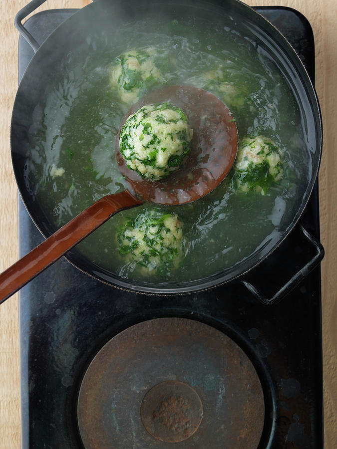 Spinach Semolina Dumplings In A Saucepan Photograph by Jan-peter Westermann