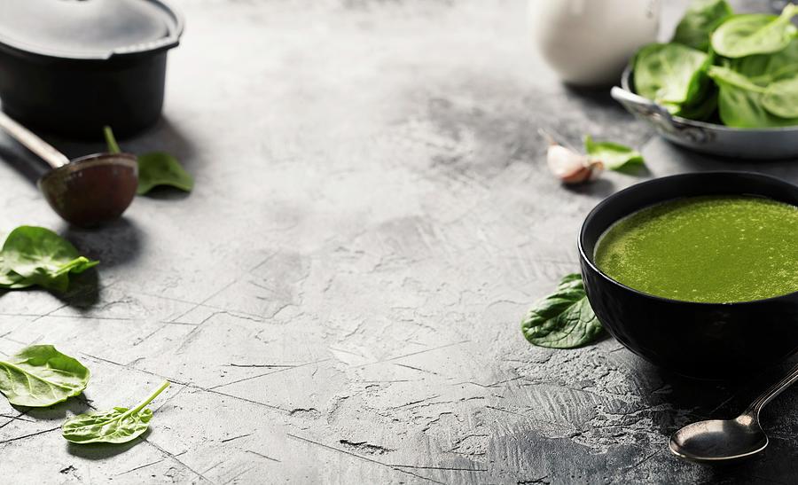 Spinach Soup And Ingredients On Rustic Background Photograph by Natalia Klenova