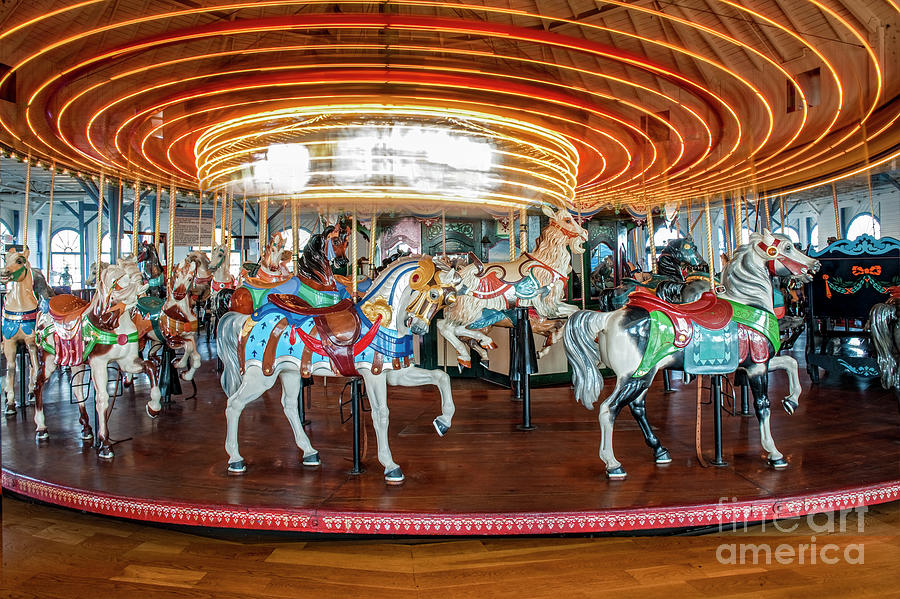 Spinning Carousel Horses Frozen Photograph by David Zanzinger