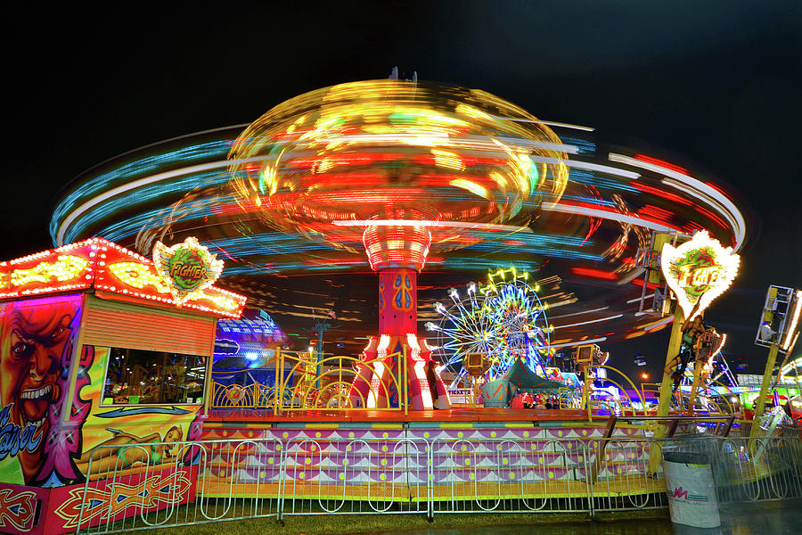 Spinning rides Photograph by David Lee Thompson - Fine Art America