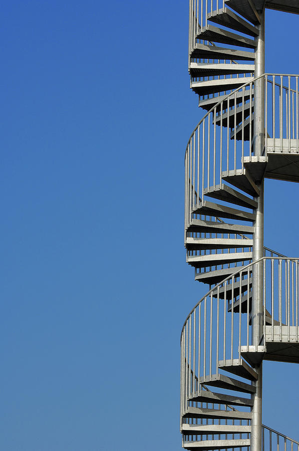 Spiral Staircase Against A Blue Sky Photograph by Martin Ruegner