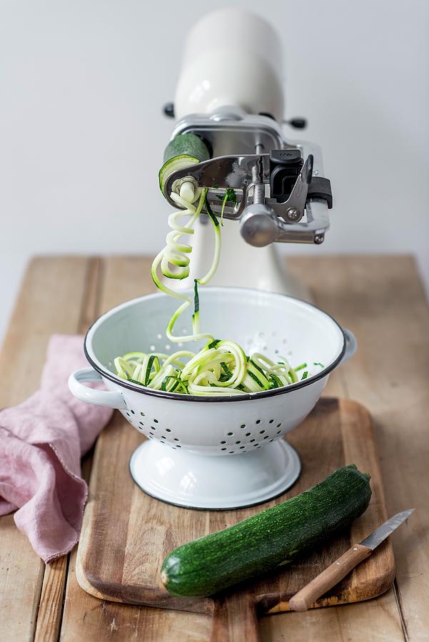 Spiralizing Courgette With A Kitchen Machine Photograph by Carolin Strothe