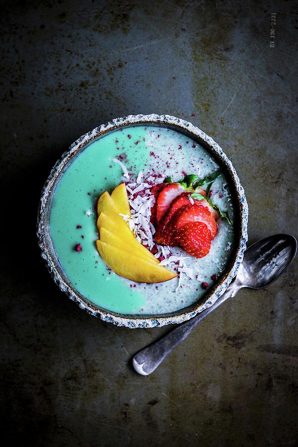 Spirulina And Chia Pudding With Peach, Strawberries And Grated Coconut Photograph by Alena Haurylik