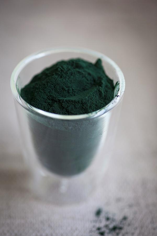 Spirulina Powder In A Glass Cup Photograph by Eising Studio