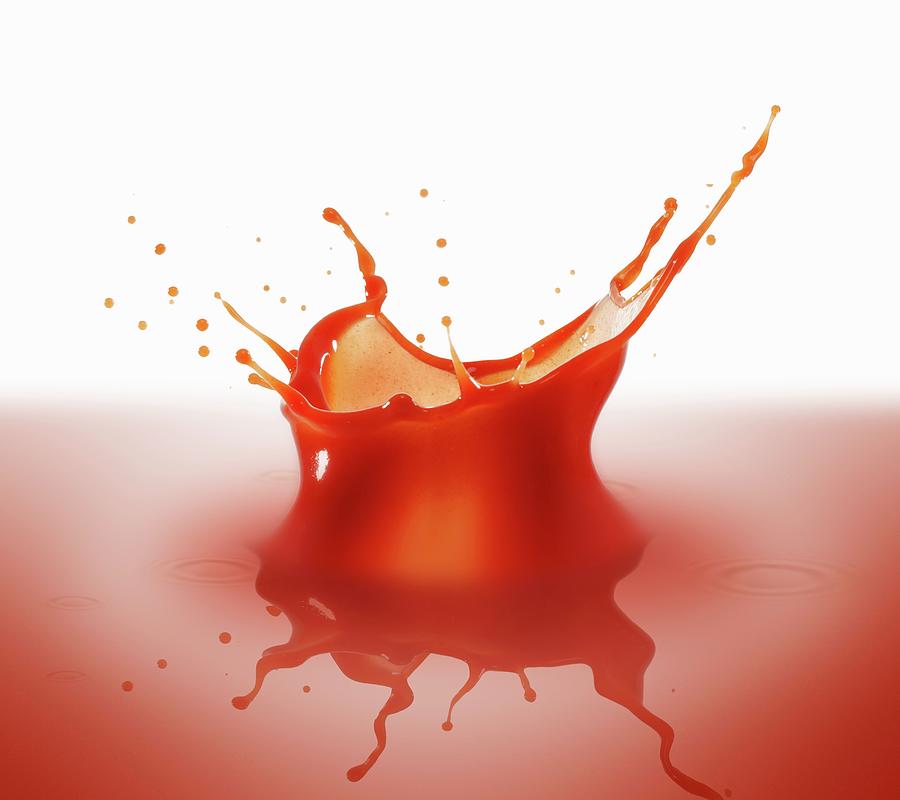 Splashing Tomato Juice Photograph by Krger & Gross