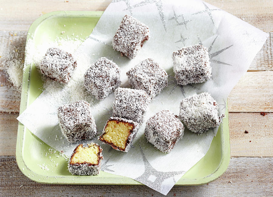 Sponge Cake Bites With Chocolate Glaze And Grated Coconut new Zealand Photograph by Teubner Foodfoto