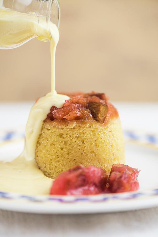 Sponge Pudding With Rhubarb And Vanilla Sauce Photograph by Russel Brown