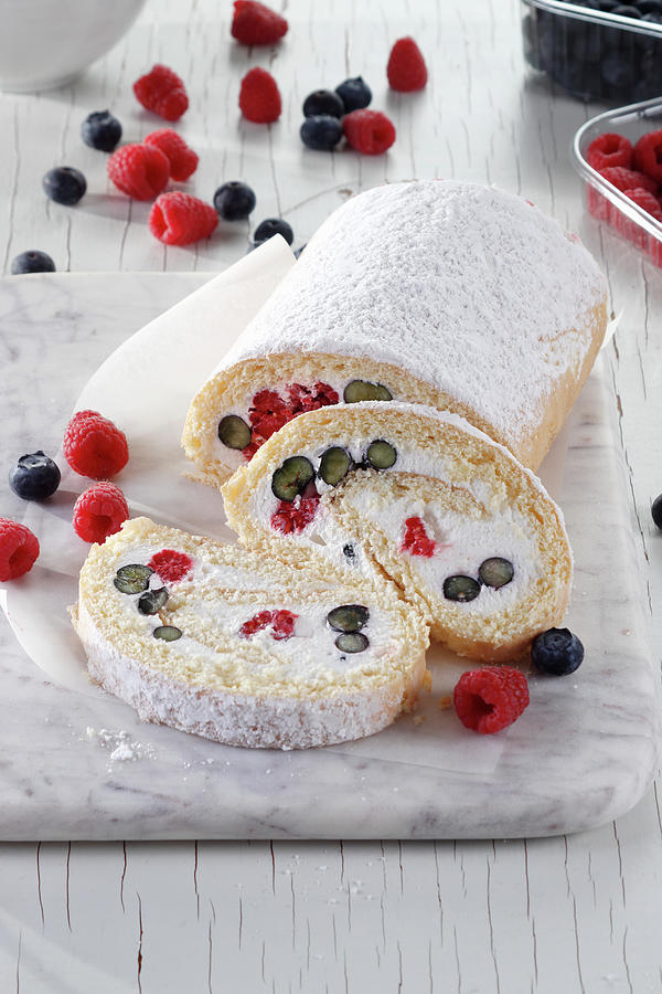 Sponge Roll With Cream And Raspberries And Blueberries Photograph by Wawrzyniak.asia