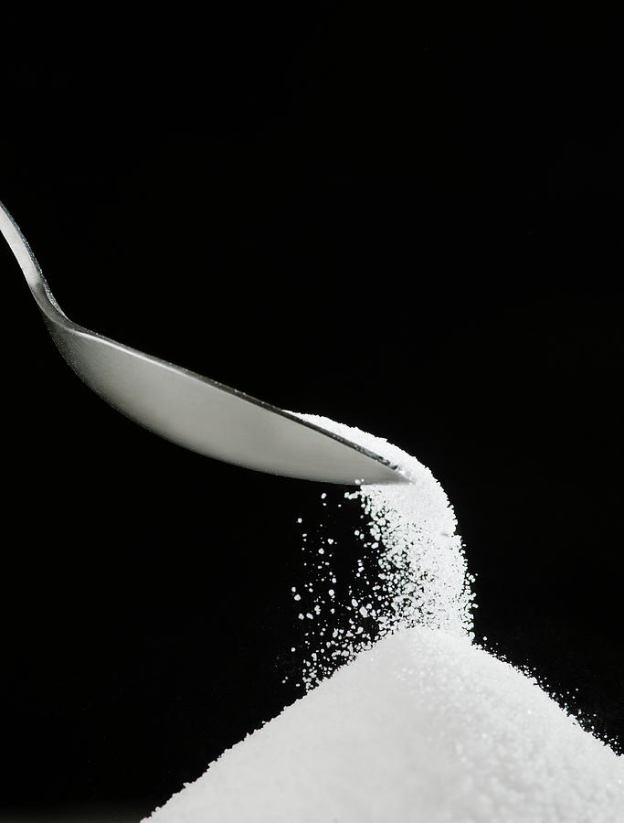 Spoon And Heap Of Sugar Photograph by Tetra Images