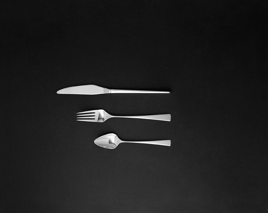 Spoon, Fork And Butter Knife On Black Photograph by Tom Kelley Archive