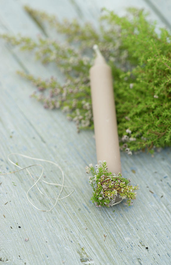 Sprigs Of Heather Wrapped Around Candle Base Photograph by Martina Schindler