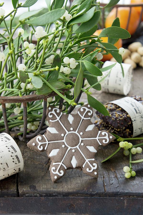 Sprigs Of Mistletoe In Metal Basket And Snowflake Biscuit festive Photograph by Martina Schindler