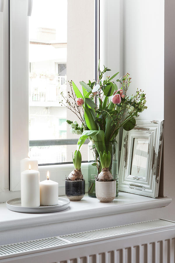 Spring Bouquet Of Tulips And White Candles On Windowsill Photograph by Hej.hem Interior