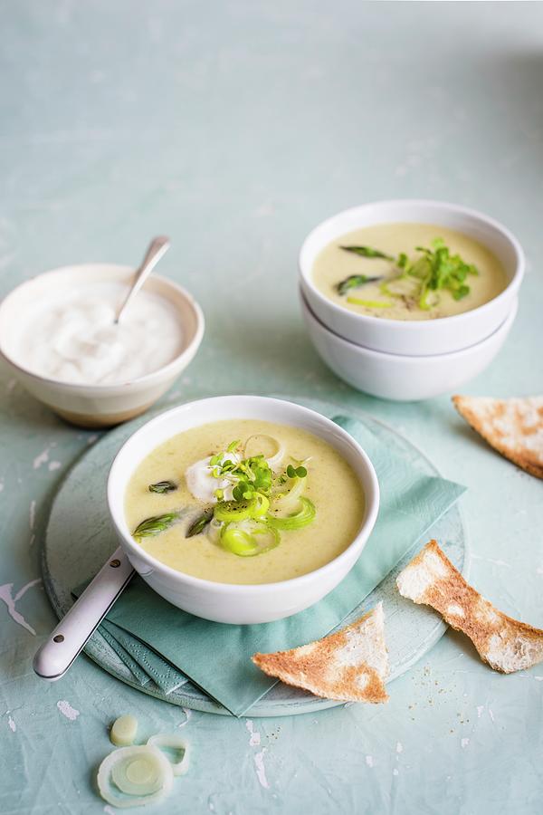 Spring Onion And Asparagus Soup With Sour Cream And Toast Photograph by Magdalena Hendey