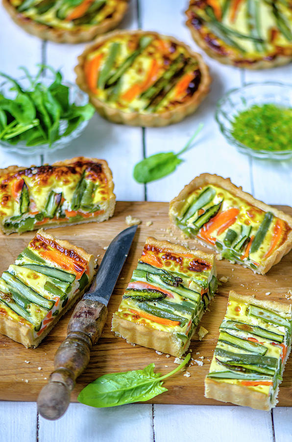 Spring Quiche With Young Vegetables, Cut On A Wooden Board Photograph by Gorobina