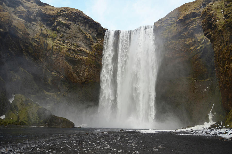 Springtime Snow Melting at Base of Grand Skogafoss Waterfall Iceland Photograph by Shawn OBrien
