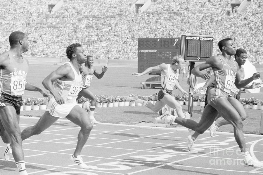 Sprinter Carl Lewis Finishing 100 Meter Photograph by Bettmann