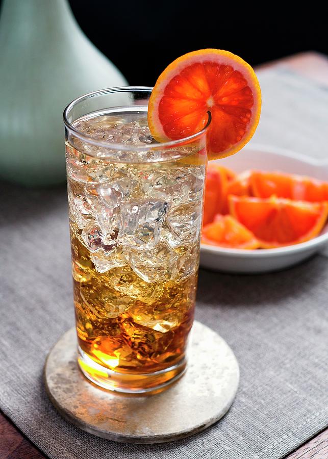 Spritzer In Collins Glass With Ice And Bloodorange Garnish Photograph by Christine Siracusa