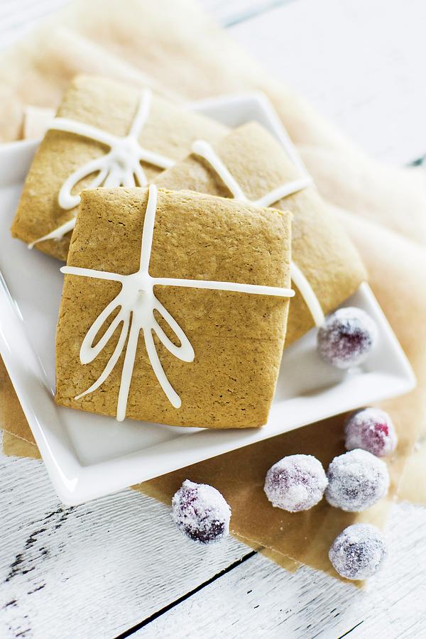 Square Gingerbread Biscuits Made With Molasses And Ginger, Decorated With Iced Bows Photograph by Sam Henderson Imagery