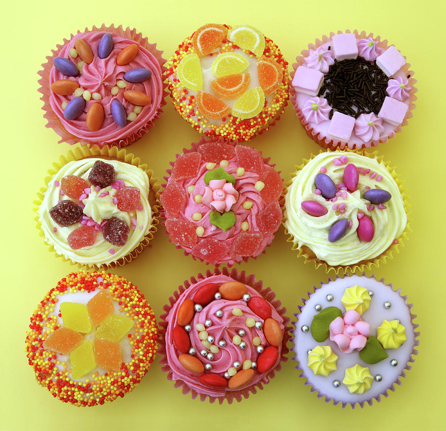 Square Of Bright Cupcakes On Yellow Photograph by Rosemary Calvert
