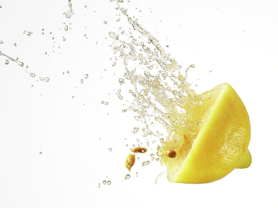 Squashed Lemon Slice Spurting Juice And Photograph by Yamada Taro
