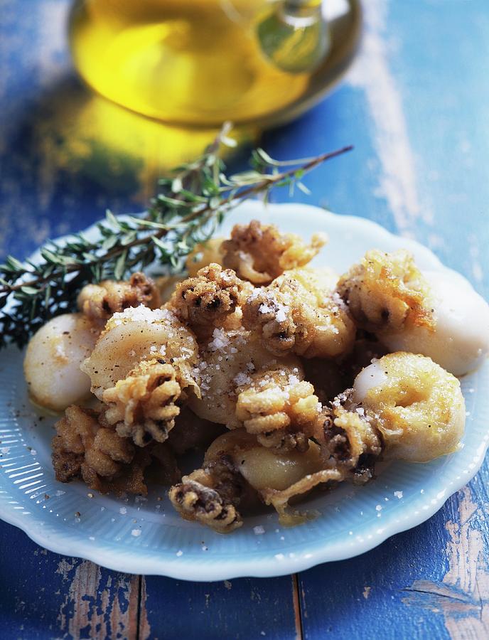 Squid And Calamary Saut With Olive Oil And Rosemary Photograph by Mallet