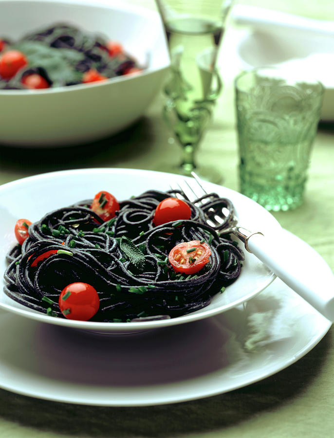 Squid Ink Pasta With Cherry Tomatoes And Sage Photograph by Gelberger
