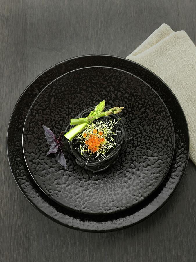 Squid Ink Spaghettis, Green Asparagus Tops, Sprouts And Salmon Roe Photograph by Gelberger