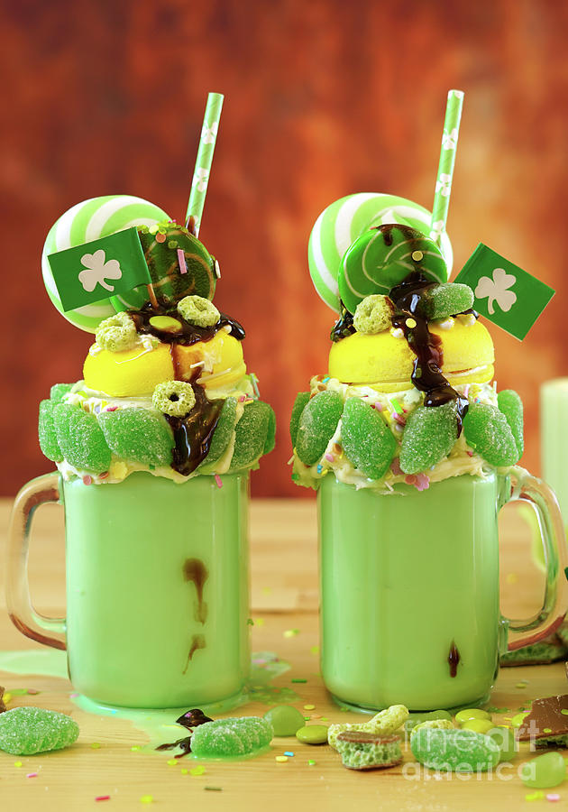 St Patricks Day on-trend holiday freak shakes with candy and lollipops. Photograph by Milleflore Images