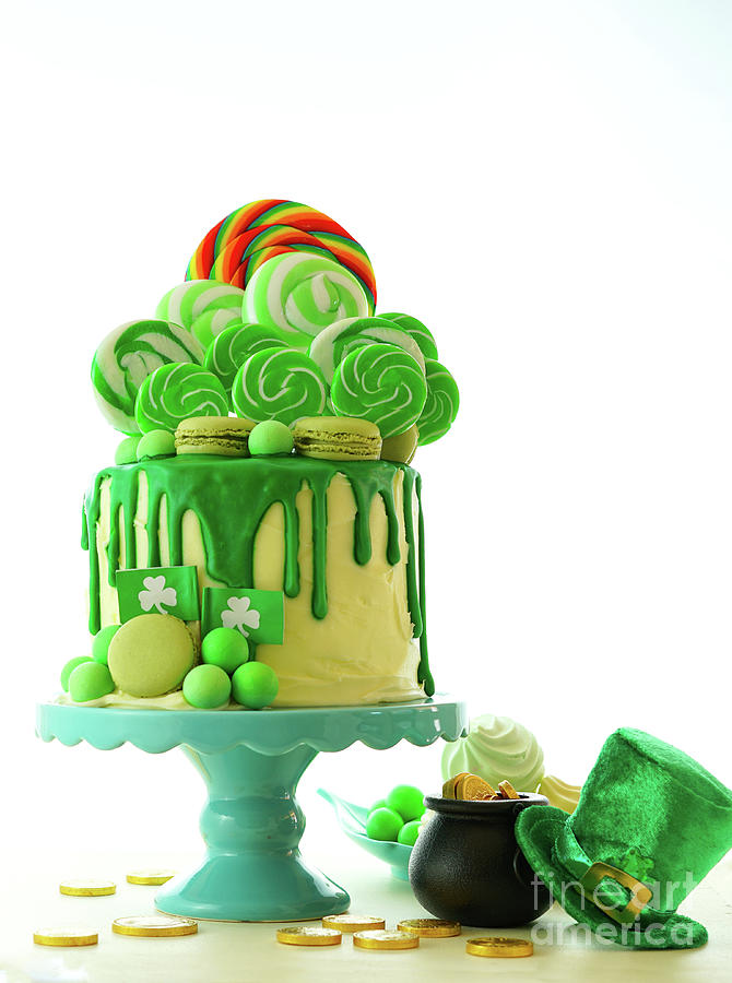 St Patricks Day theme lollipop candy land drip cake. Photograph by Milleflore Images