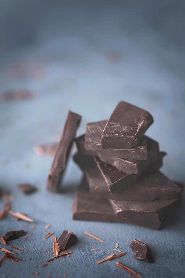 Stack Of A Dark Chocolate Pieces Photograph by Malgorzata Laniak