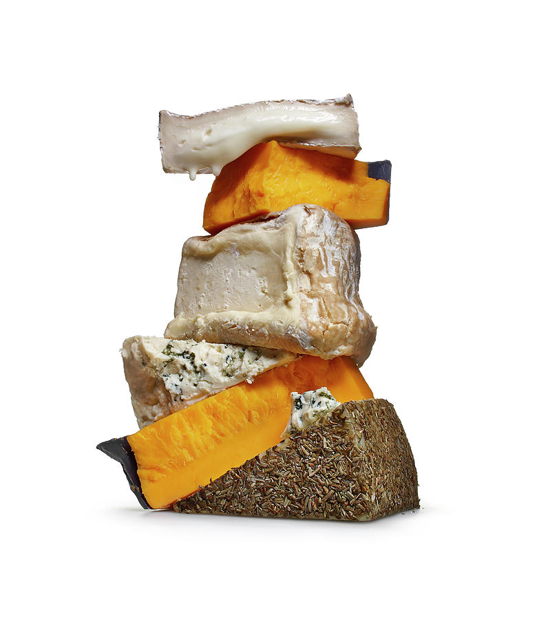 Stack Of Cheeses Photograph by Lew Robertson