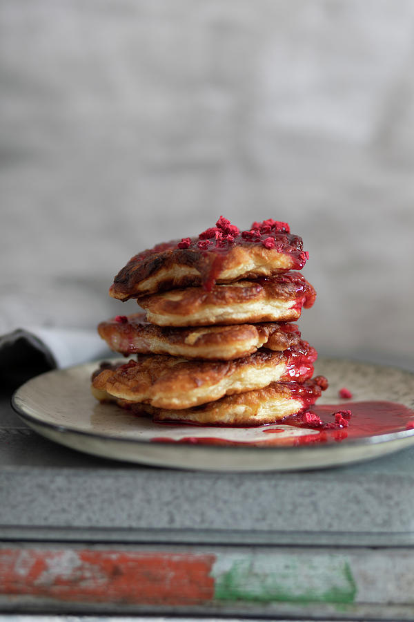 Stack Of Homemade Fritters With Raspberry Coulis Photograph by Lilia Jankowska