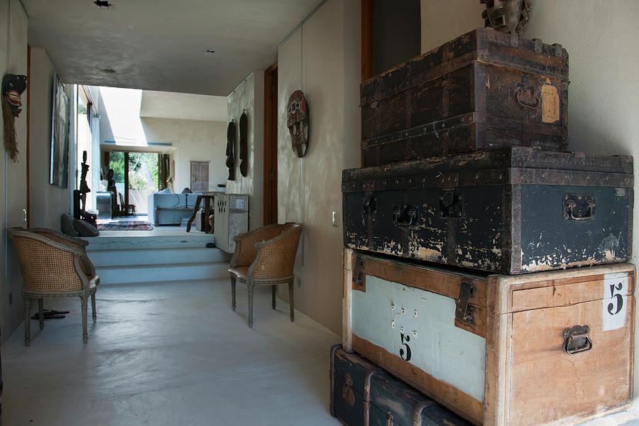 Stack Of Old Steamer Trunks In Foyer Of Bungalow With View Into Interior Photograph by Christophe Madamour