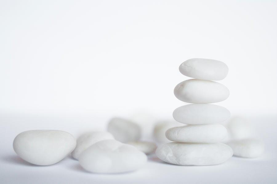 Stack Of White Pebbles On White Photograph by G.g.bruno