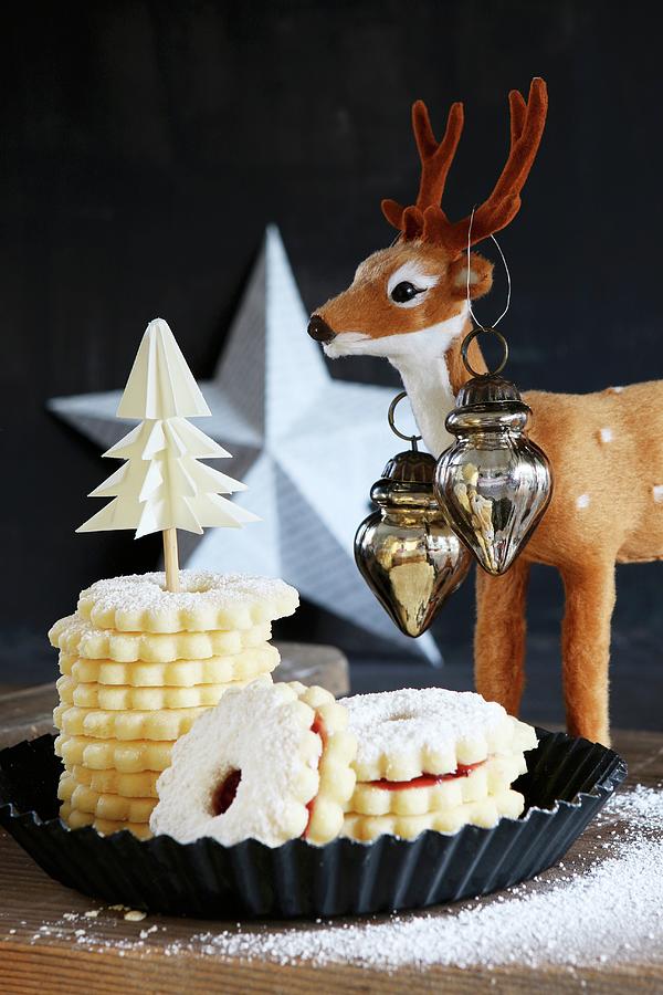 Stacked Gluten-free Christmas Hildapltzchen jam-filled Shortbread Biscuits With A Reindeer And A White Star Photograph by Regina Hippel