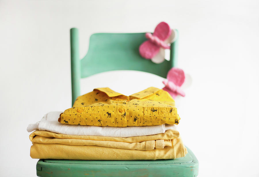 Stacked Linen And Hand-made Felt Butterflies On Green Chair Photograph by Alicja Koll