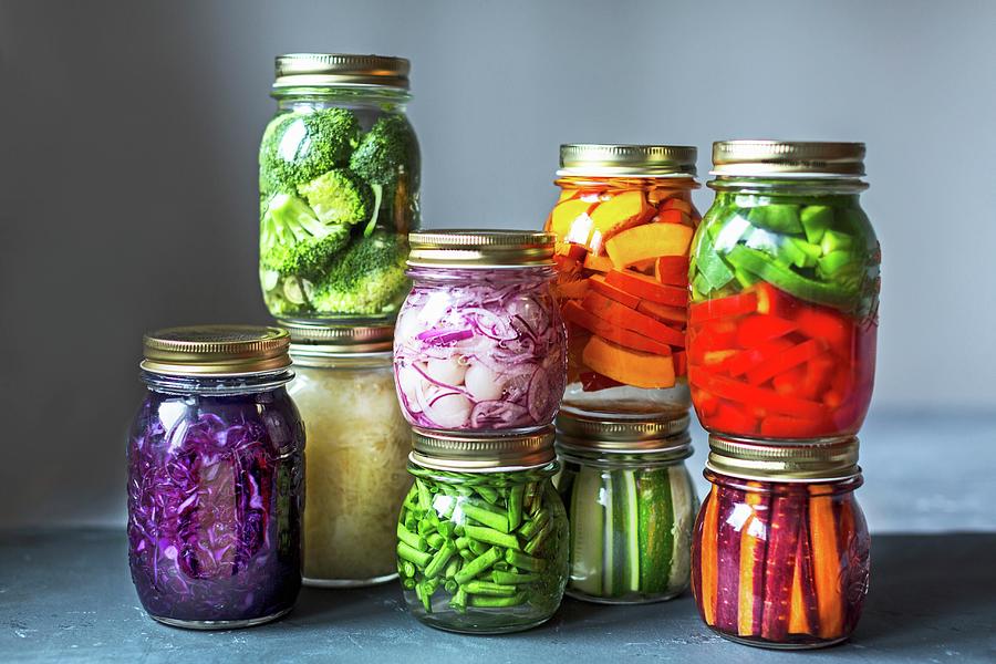 Stacked Preserving Jars Of Freshly Pickled Vegetables In Front Of A ...