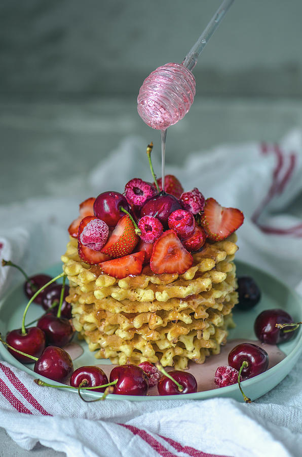 Stacked Waffles With Berries, Cherries And Honey Photograph by Gorobina