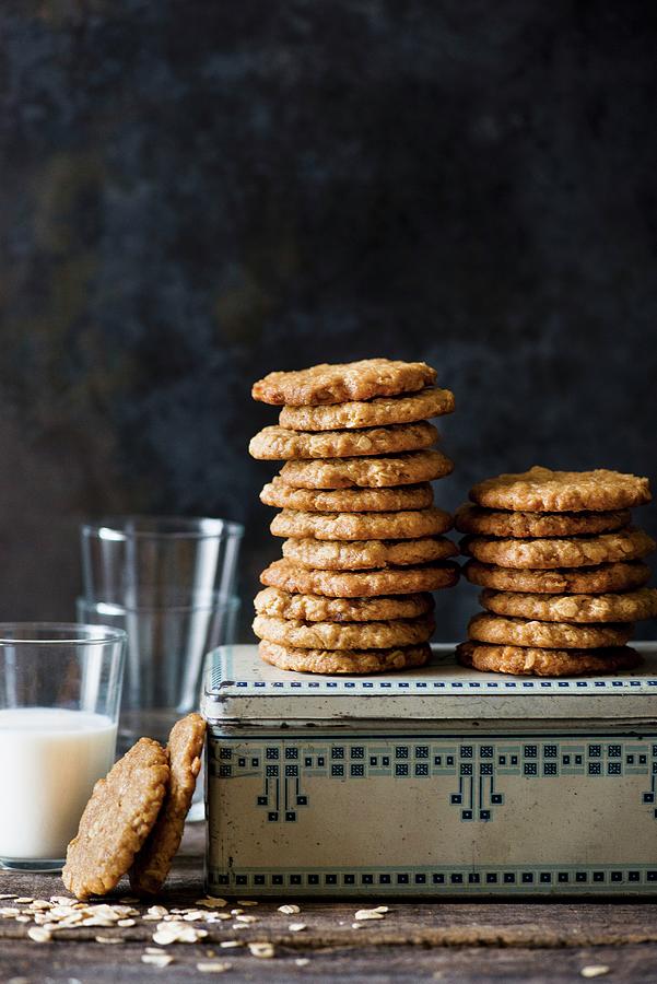 Stacks Of Anzac Biscuits On A Biscuit Tin Photograph by The White Ramekins