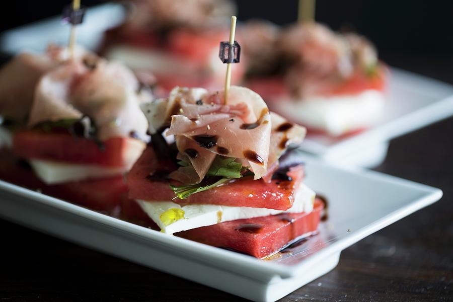 Stacks Of Watermelon And Cheeps Cheese With A Slice Of Parma Ham With An Olive Oil And Balsamic Vinegar Dressing Photograph by Nicole Godt