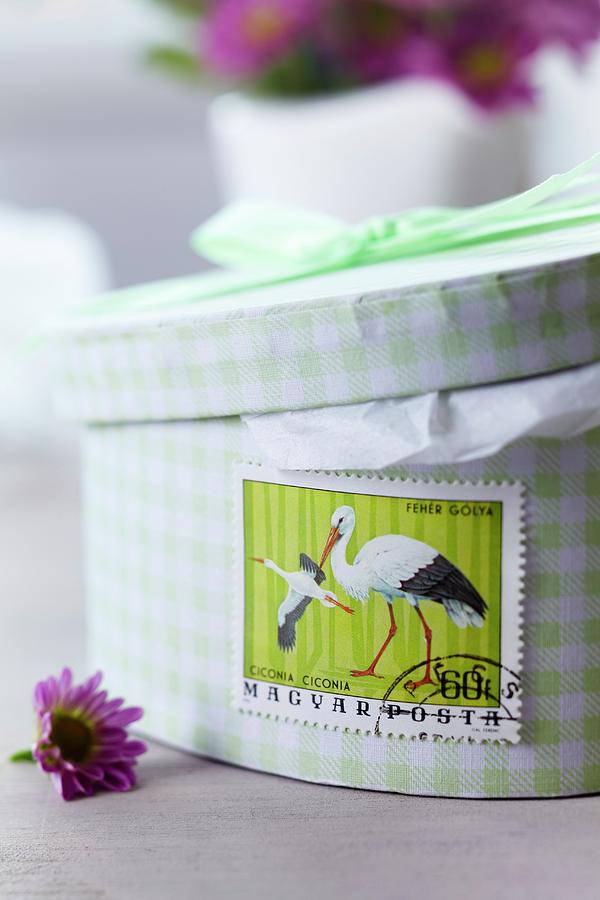Stamp With Stork Motif Stuck On Gift Box For Baby Shower Photograph by Franziska Taube