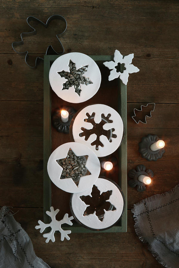 Star And Snowflake Pendants And Lit Candles Photograph by Regina Hippel