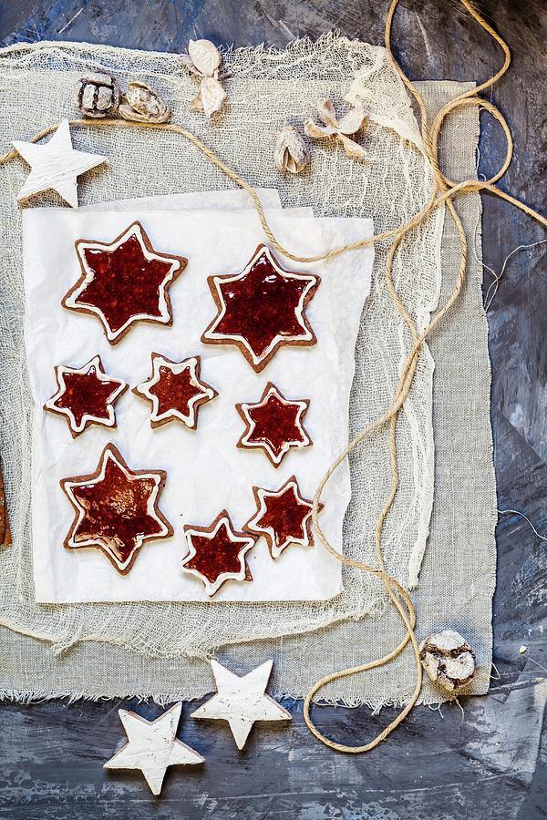 Star Shaped Almond Biscuits Filled With Redcurrant Jelly Photograph by Susan Brooks-dammann