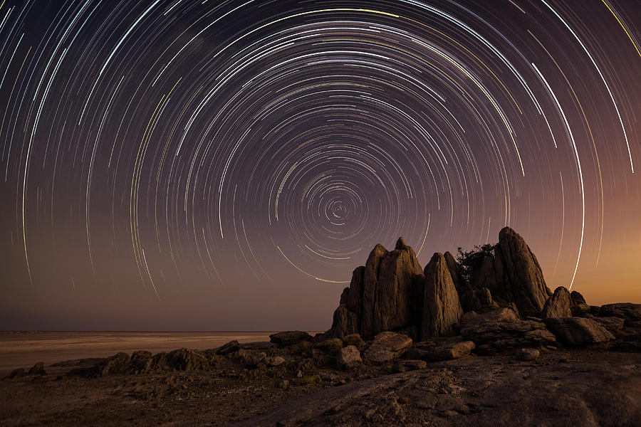 Star Trail Over The Dry Granite Rock Photograph by Nhpa