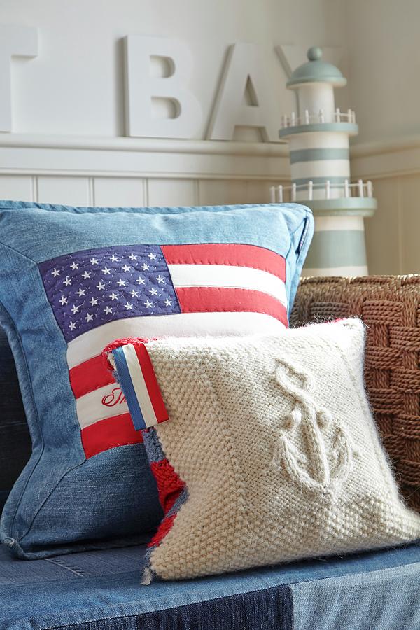 Stars And Stripes Cushion On Sofa With Miniature Lighthouse In Background Photograph by Tim Imri
