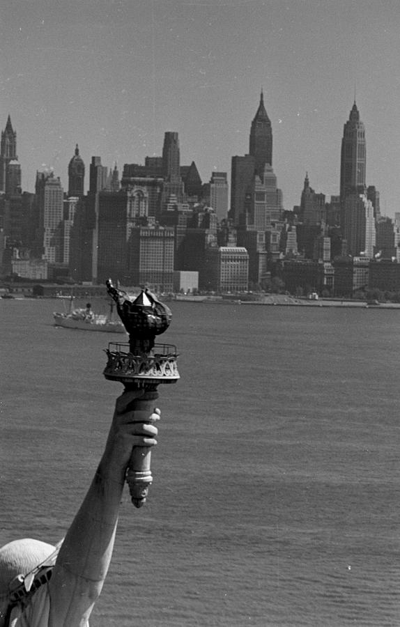 Statue of Liberty with Manhattan in background. Photograph by Margaret Bourke-White