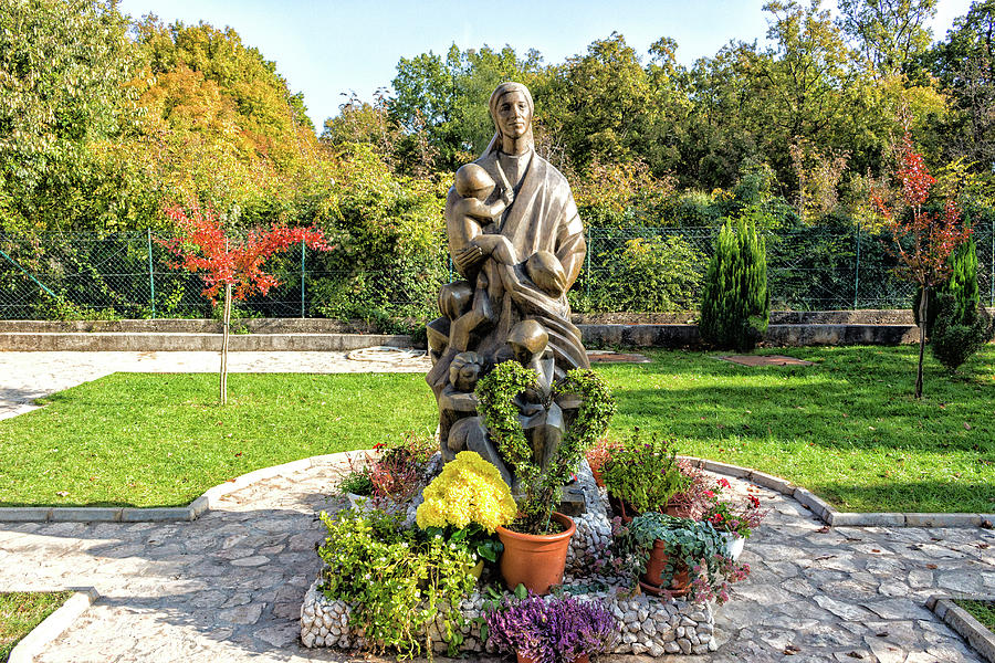 Statue of nun with children in Medugorje Photograph by Vivida Photo PC